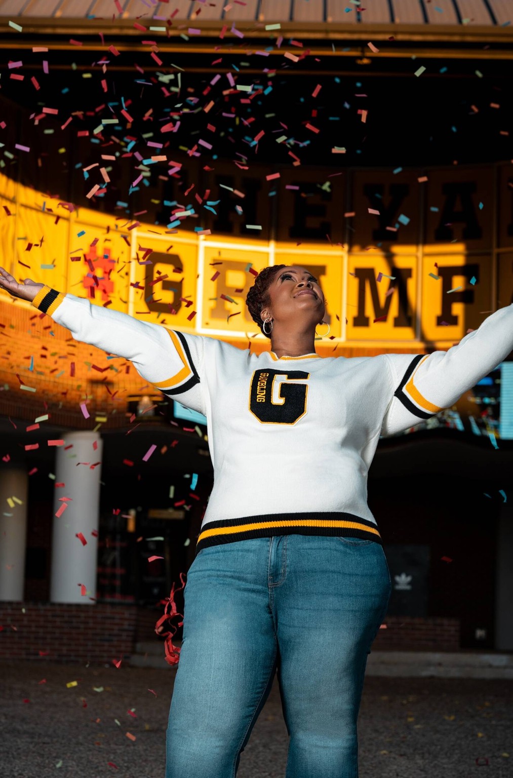 Graduate under confetti