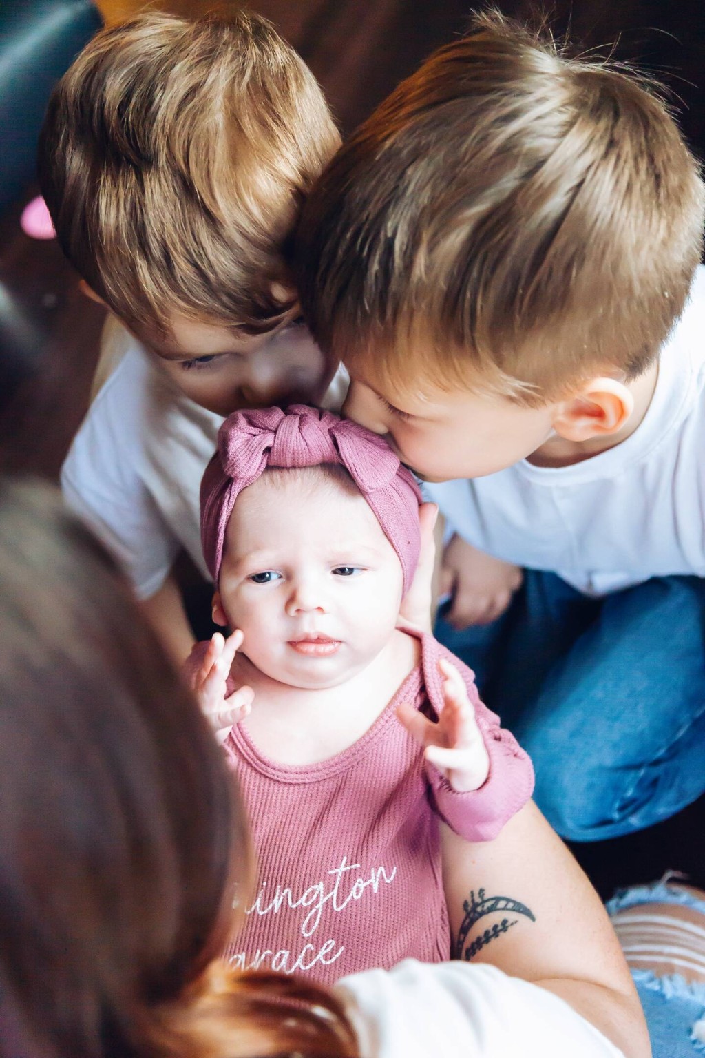 Siblings with newborn baby